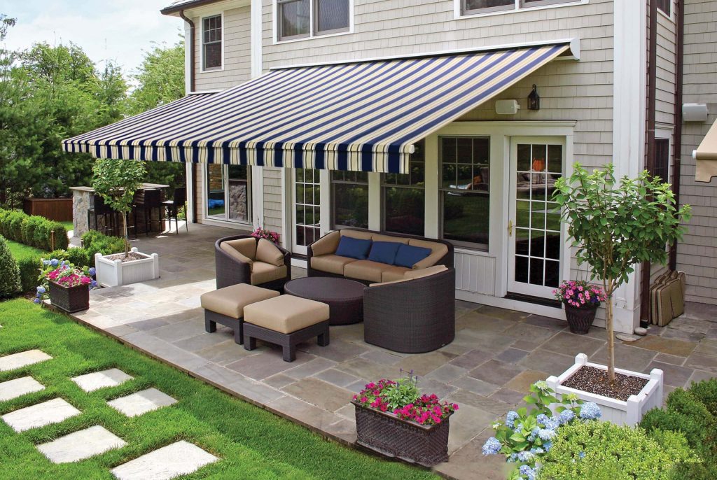 Modern retractable awning design installed on contemporary Ohio home showcasing clean lines and premium materials